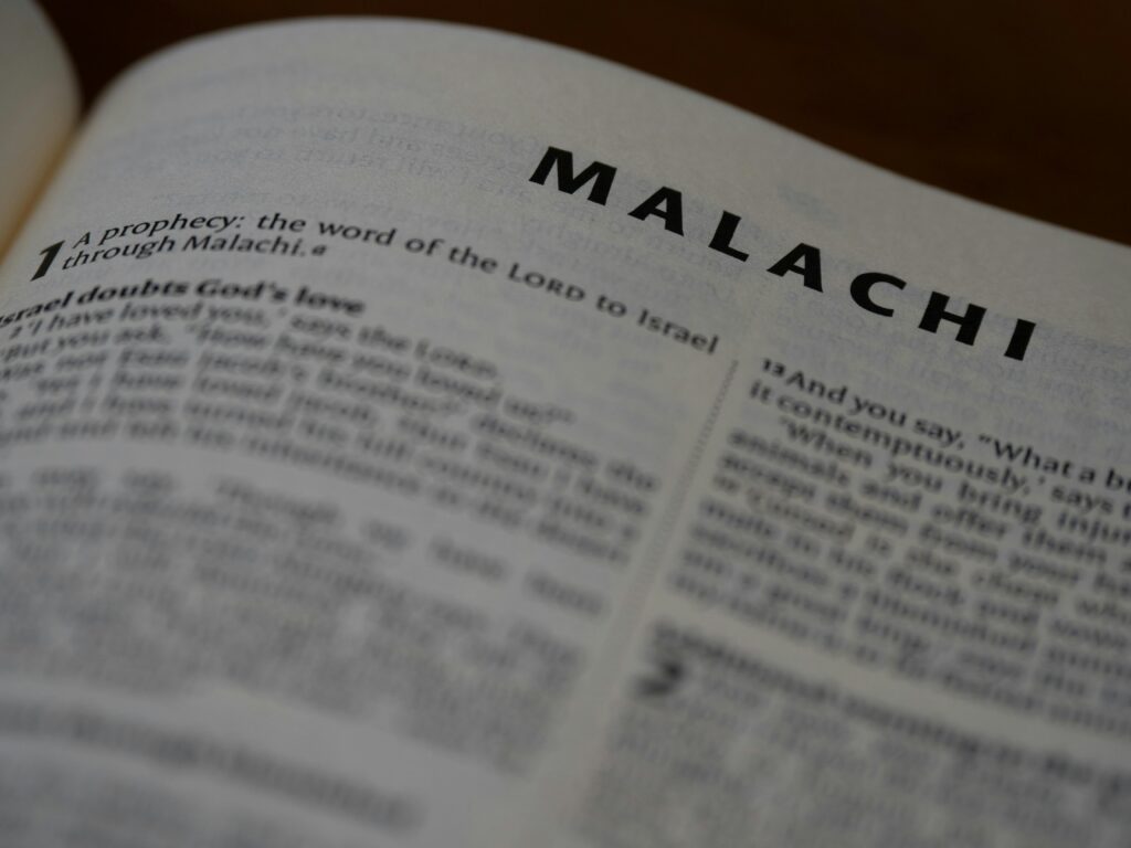 Detailed view of the Book of Malachi in the Holy Bible, highlighting scripture and typography.