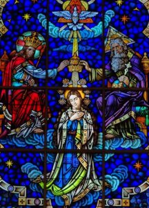 Vibrant stained glass showcasing religious figures and symbolism, ideal for spiritual themes.